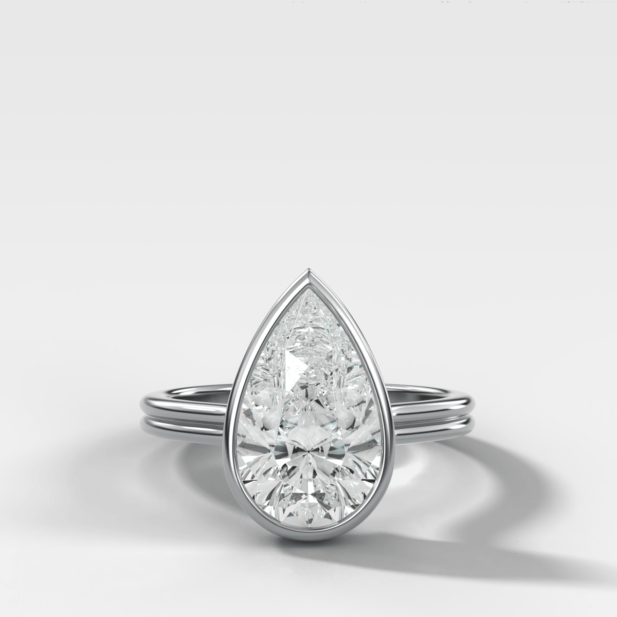 Double Row Penumbra Bezel Engagement Ring With Pear Cut Diamond - GOODSTONE