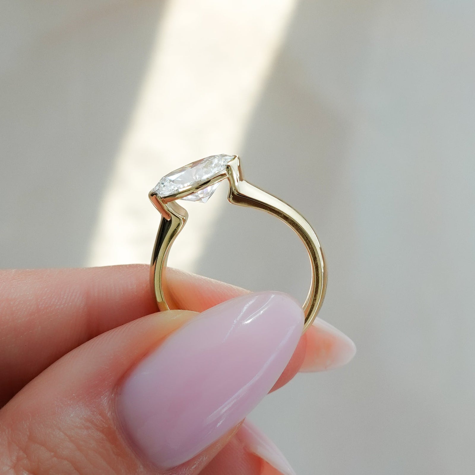 East West Half Bezel 4mm Solitaire Engagement Ring With Oval Cut Diamond - GOODSTONE