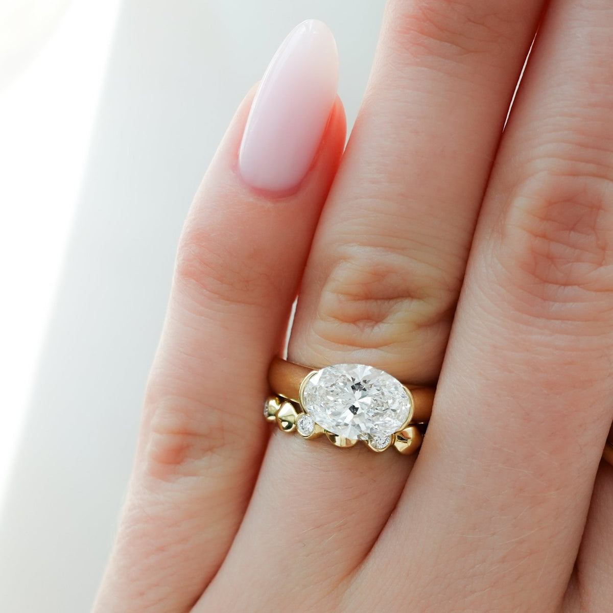 East West Half Bezel 4mm Solitaire Engagement Ring With Oval Cut Diamond - GOODSTONE