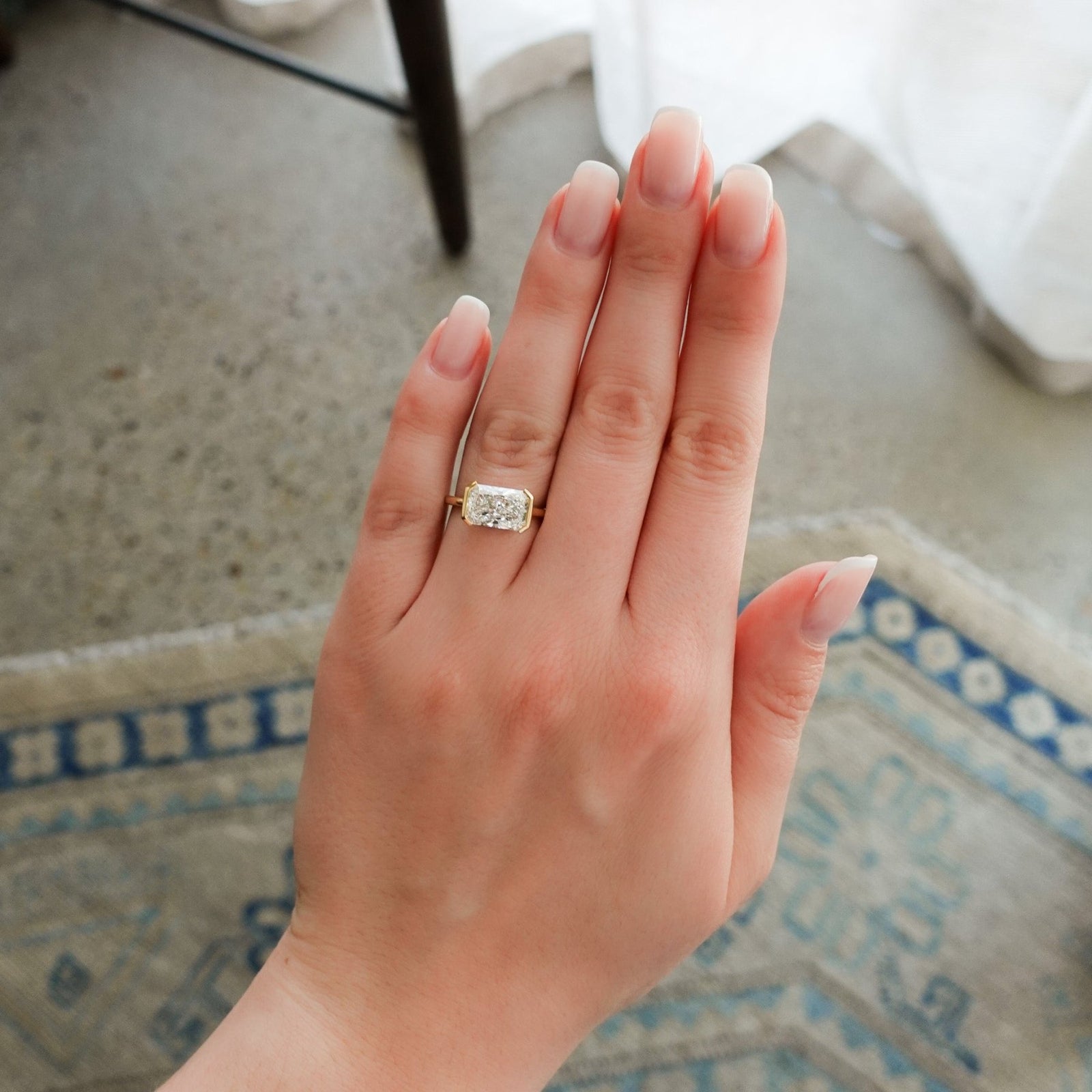East West Half Bezel Solitaire Engagement Ring With 4.07ct Radiant Cut Lab Grown Diamond - GOODSTONE