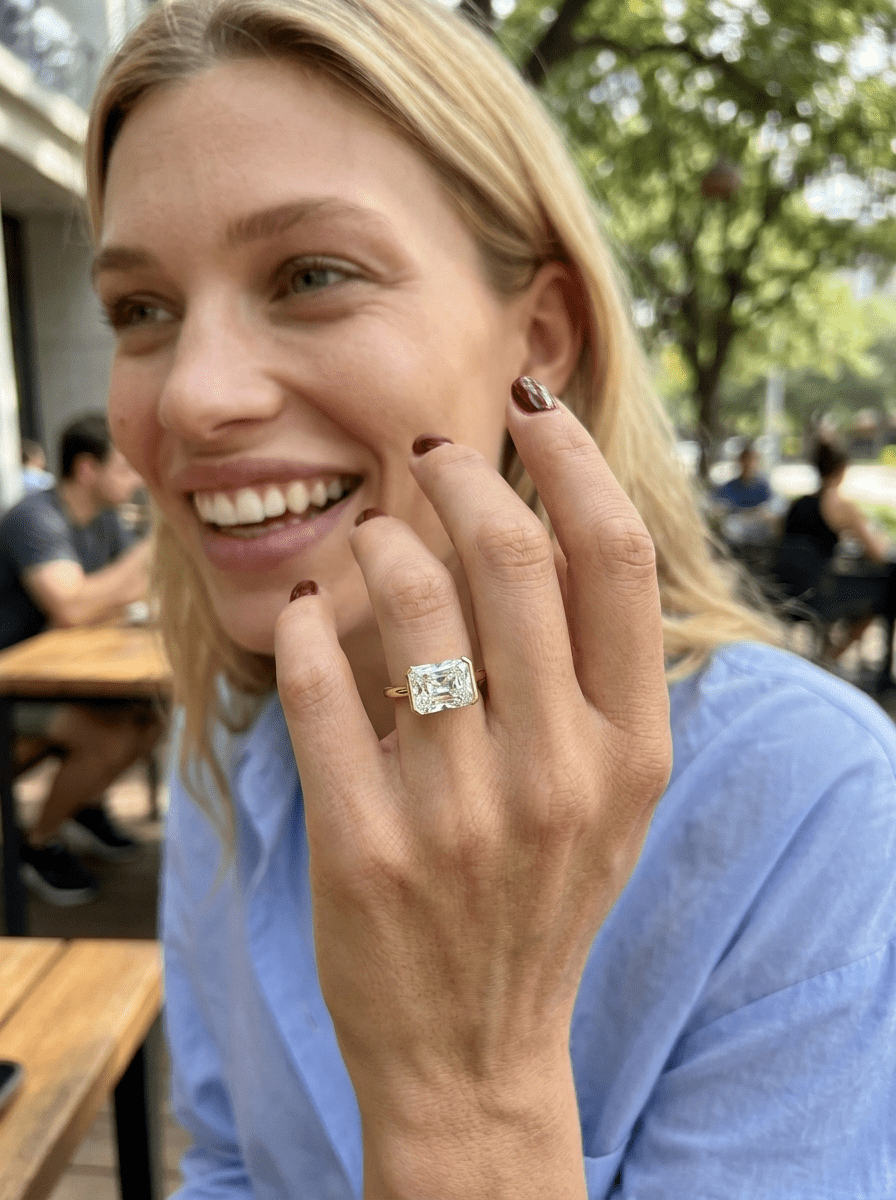 East West Half Bezel Solitaire Engagement Ring With Elongated Radiant Cut Diamond - GOODSTONE
