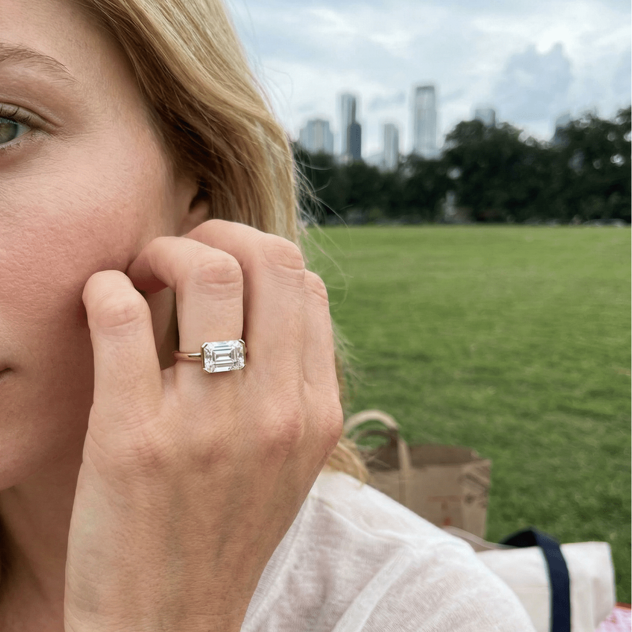 East West Half Bezel Solitaire Engagement Ring With Emerald Cut Diamond - GOODSTONE