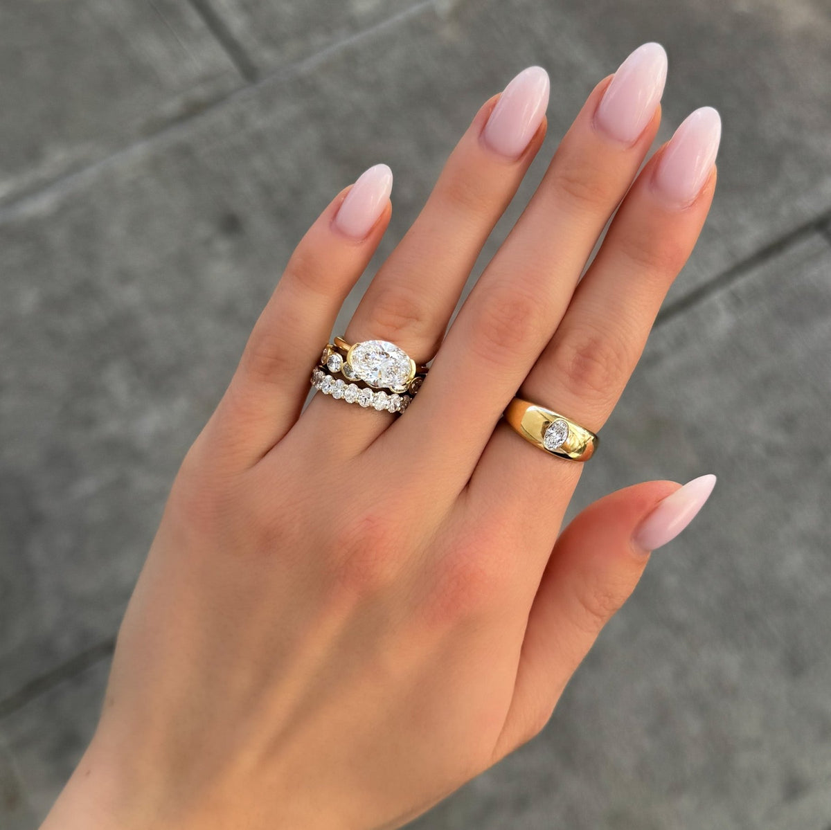 East West Half Bezel Solitaire Engagement Ring With Oval Cut Diamond - GOODSTONE