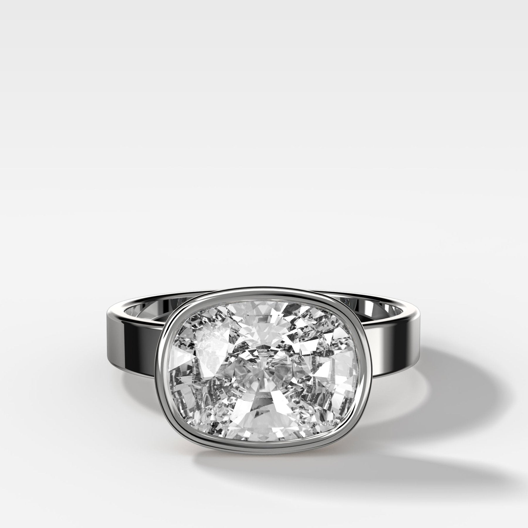 Finest Bezel Set Engagement Ring With East West Elongated Cushion Cut Diamond - GOODSTONE