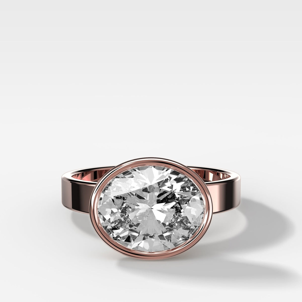 Finest Bezel Set Engagement Ring With East West Oval Cut Diamond - GOODSTONE