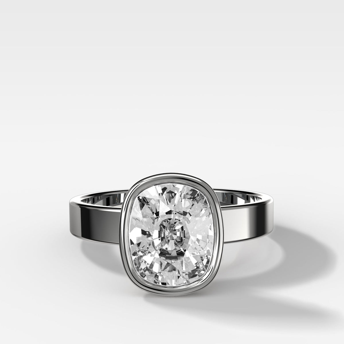 Finest Bezel Set Engagement Ring With Elongated Cushion Cut Diamond - GOODSTONE