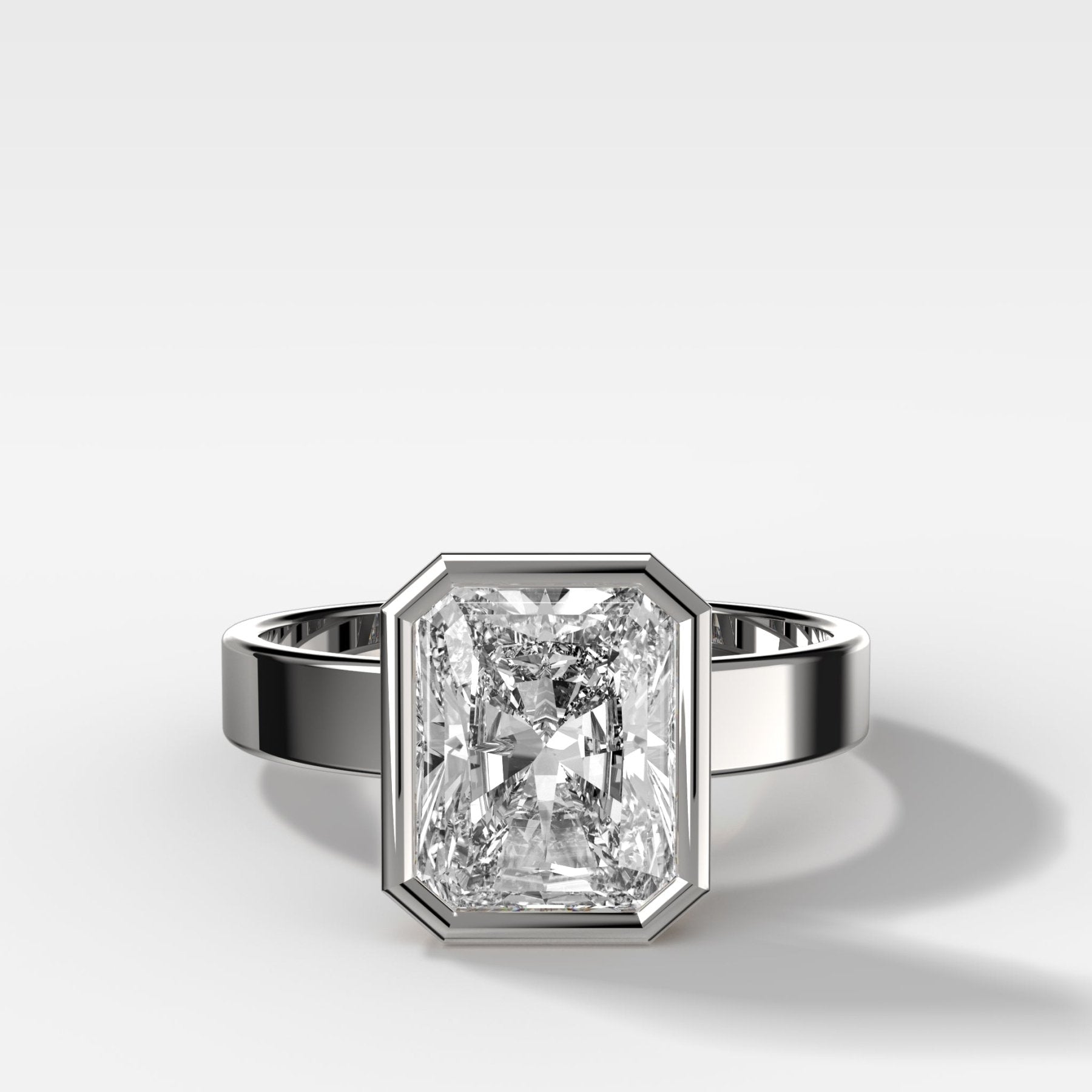 Finest Bezel Set Engagement Ring With Elongated Radiant Cut Diamond - GOODSTONE