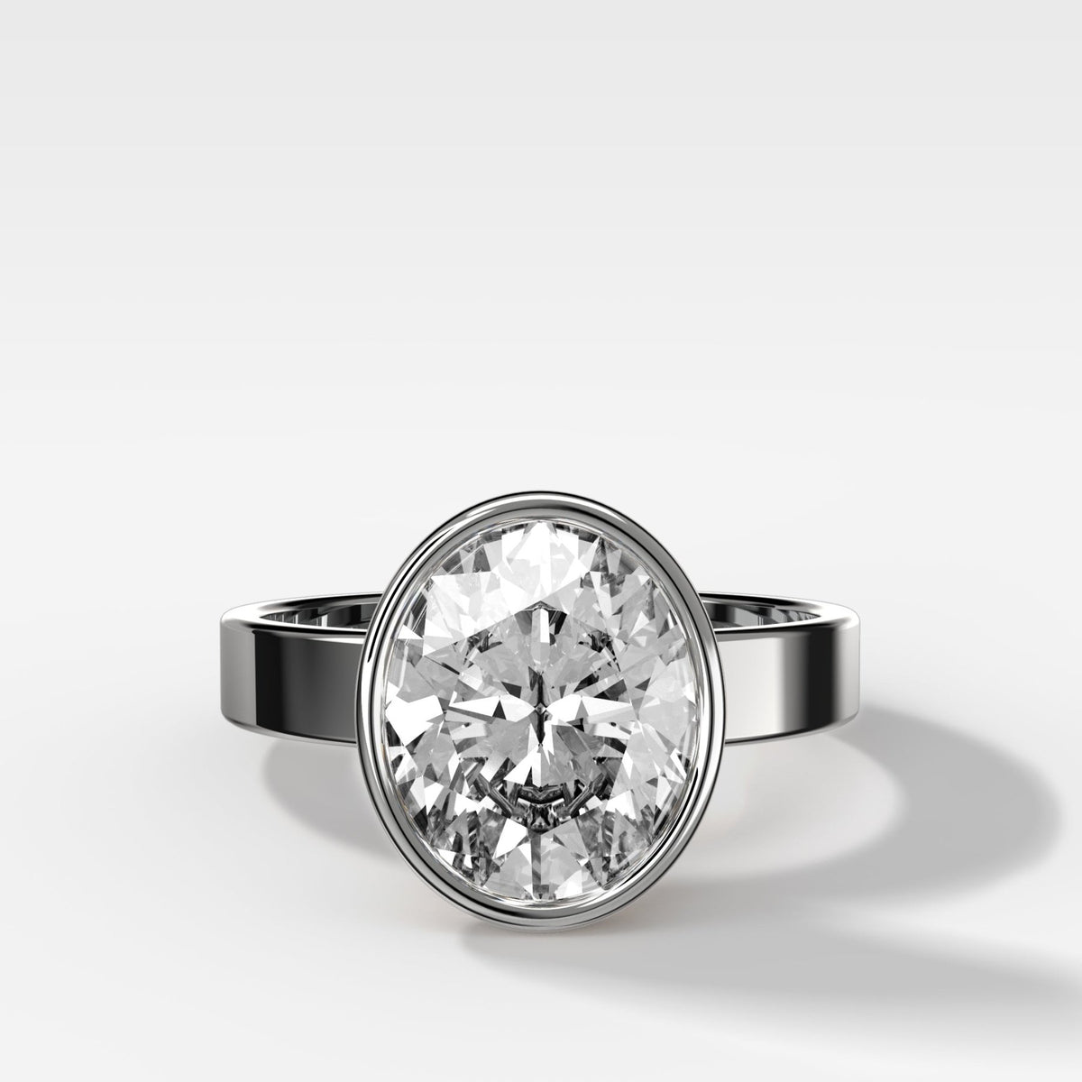 Finest Bezel Set Engagement Ring With Oval Cut Diamond - GOODSTONE