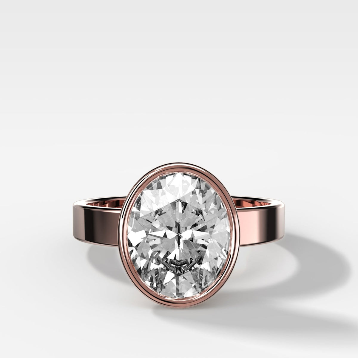 Finest Bezel Set Engagement Ring With Oval Cut Diamond - GOODSTONE