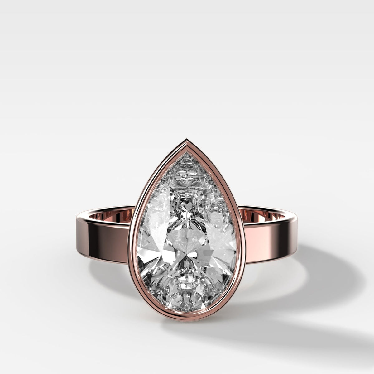 Finest Bezel Set Engagement Ring With Pear Cut Diamond - GOODSTONE