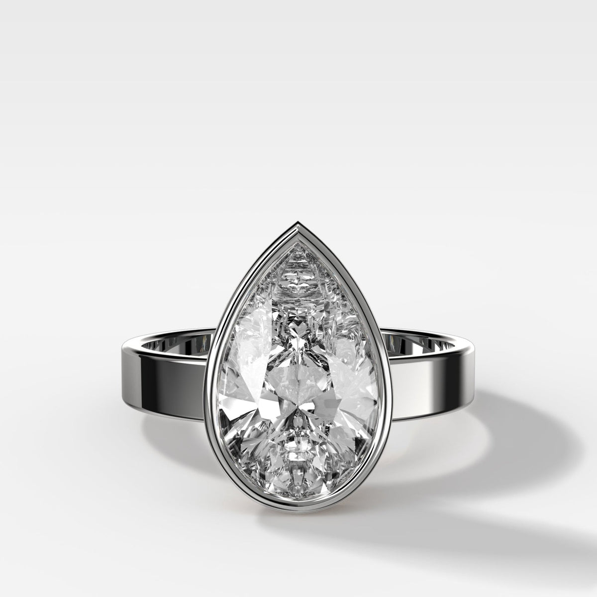 Finest Bezel Set Engagement Ring With Pear Cut Diamond - GOODSTONE