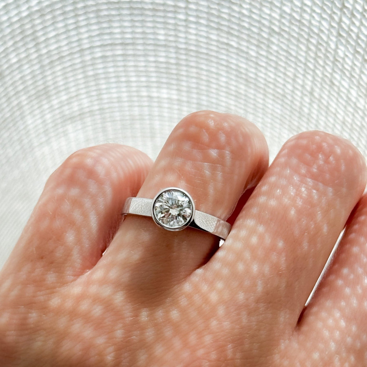 Finest Bezel Set Engagement Ring With Round Cut Diamond - GOODSTONE