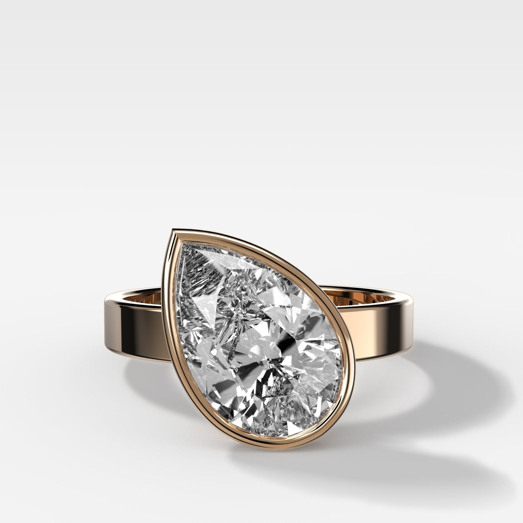 Finest Bezel Set Engagement Ring With Tilted Pear - GOODSTONE