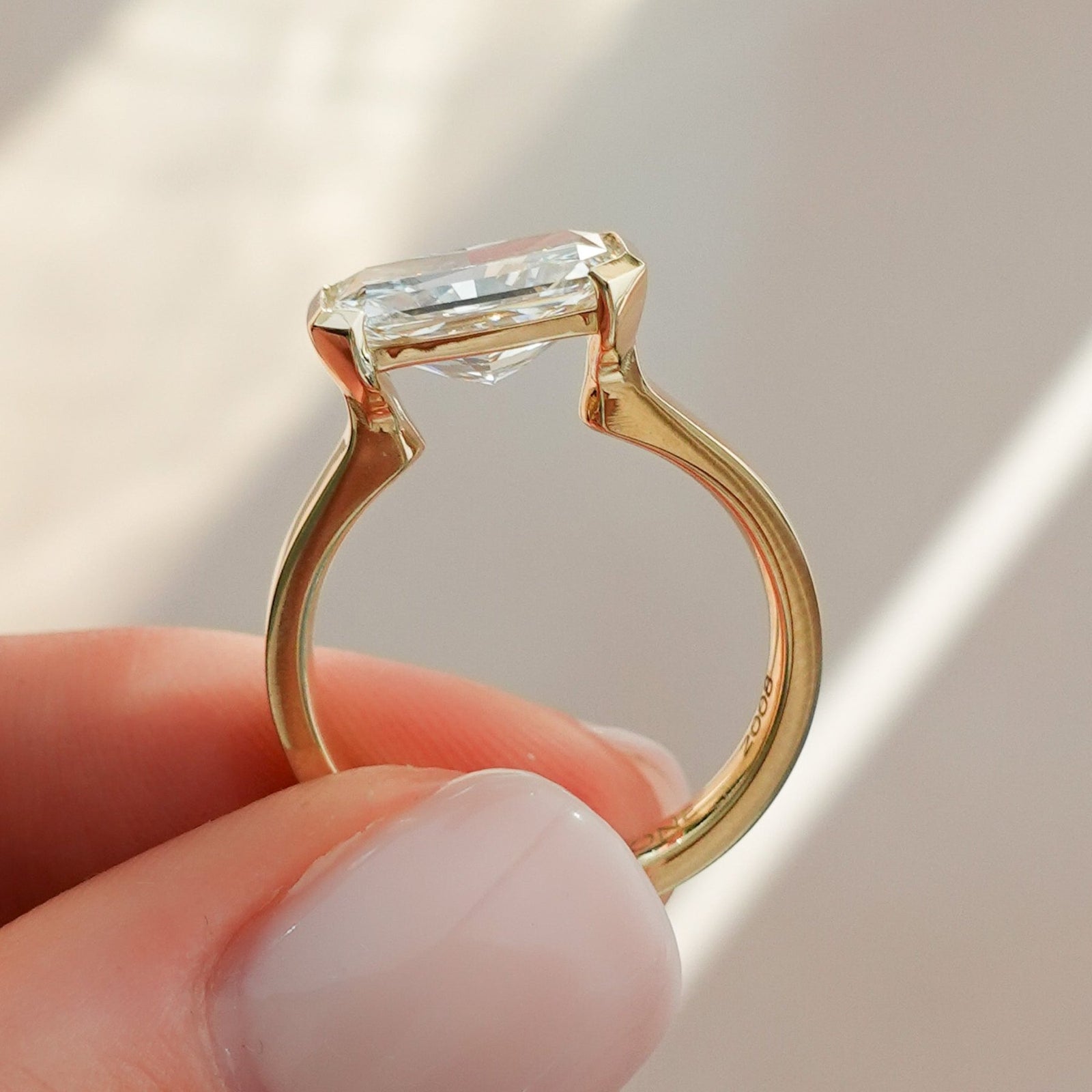 Finest Half Bezel Solitaire Engagement Ring With East West Elongated Radiant Cut Diamond - GOODSTONE