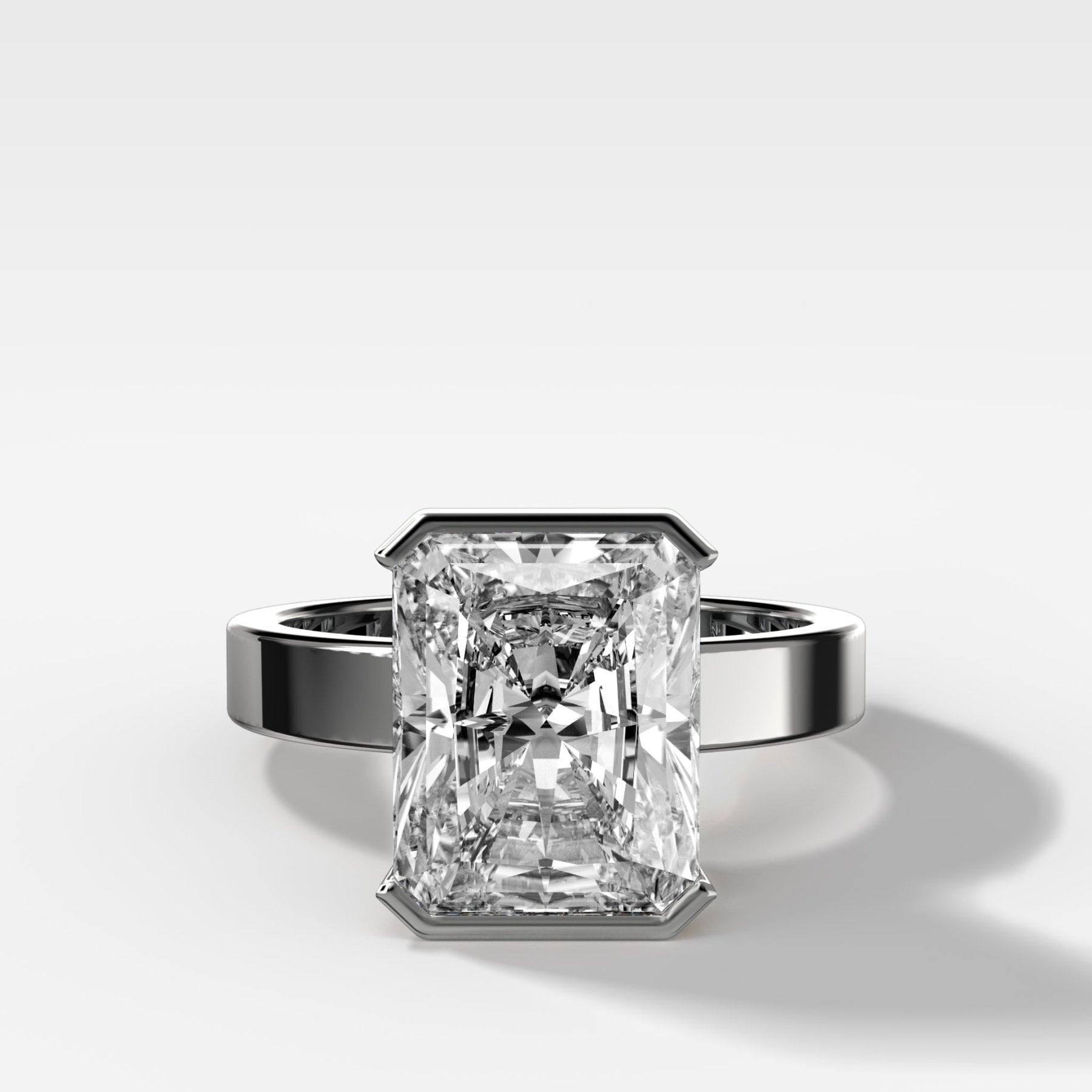 Finest Half Bezel Solitaire Engagement Ring With Elongated Radiant Cut Diamond - GOODSTONE