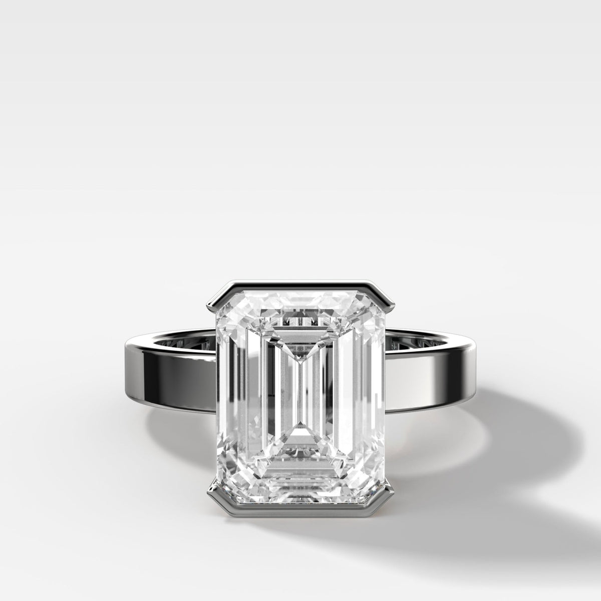 Finest Half Bezel Solitaire Engagement Ring With Emerald Cut Diamond - GOODSTONE