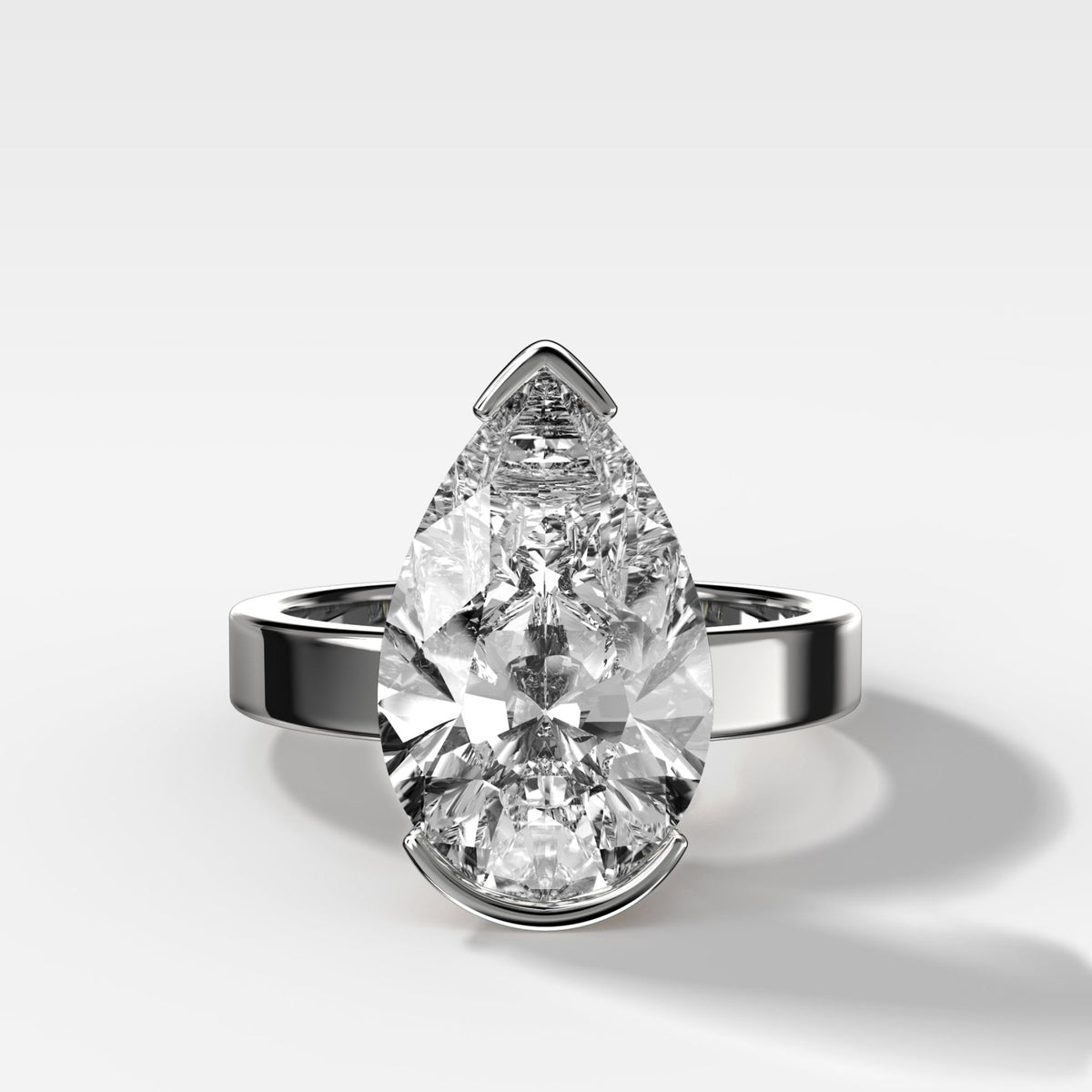 Finest Half Bezel Solitaire Engagement Ring With Pear Cut Diamond - GOODSTONE