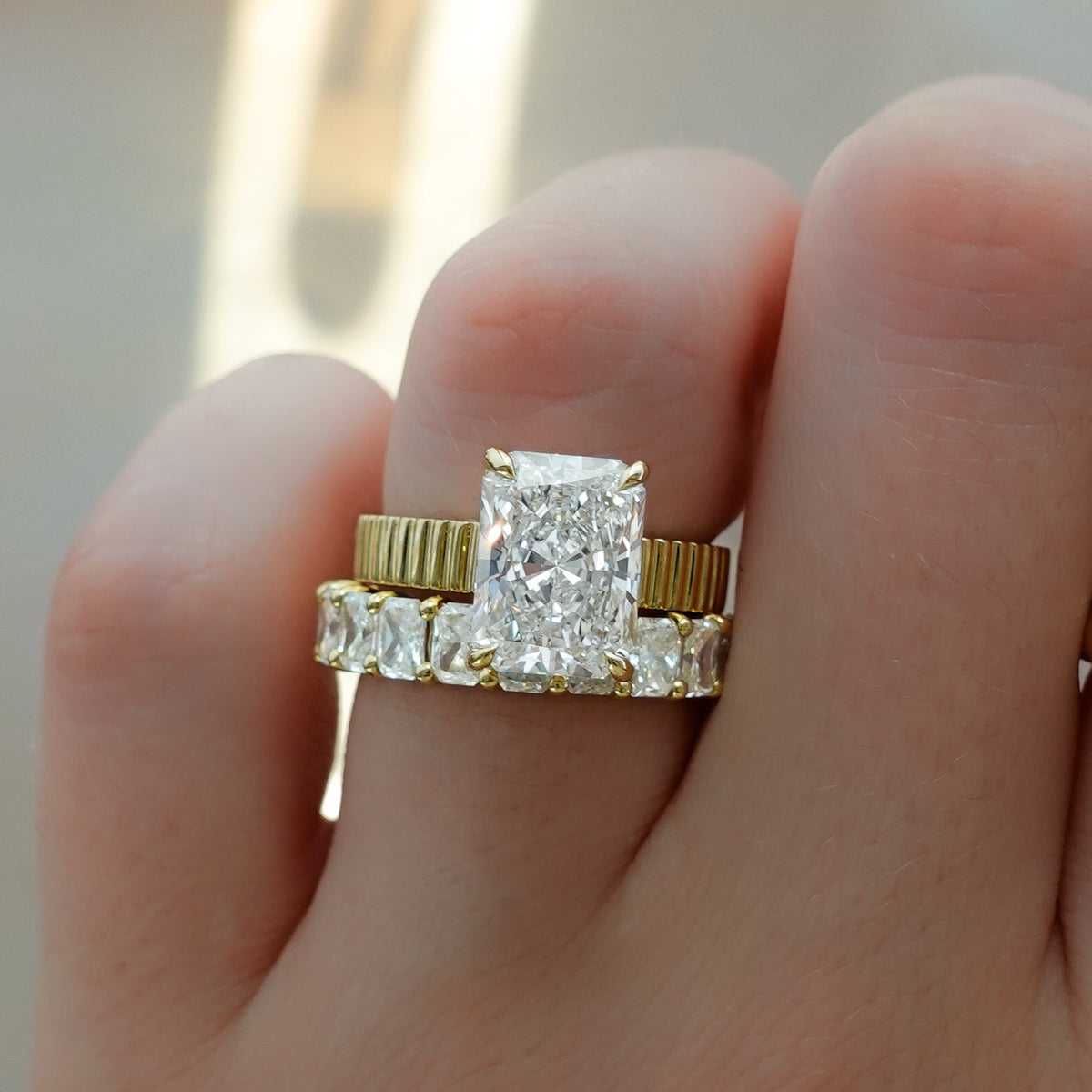 Finest Ridged Solitaire Engagement Ring With Elongated Radiant Cut Diamond - GOODSTONE