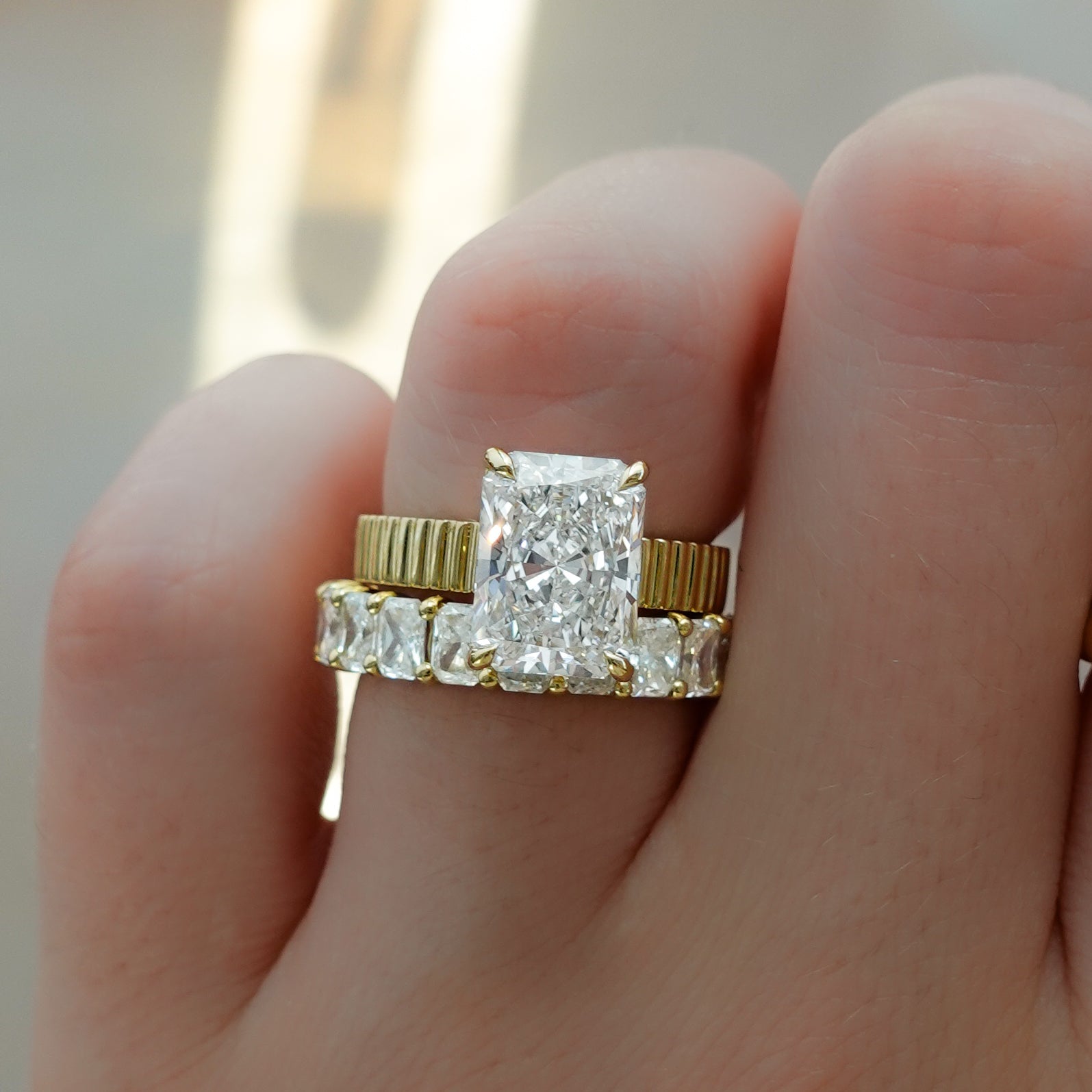 Finest Ridged Solitaire Engagement Ring With Elongated Radiant Cut Diamond - GOODSTONE