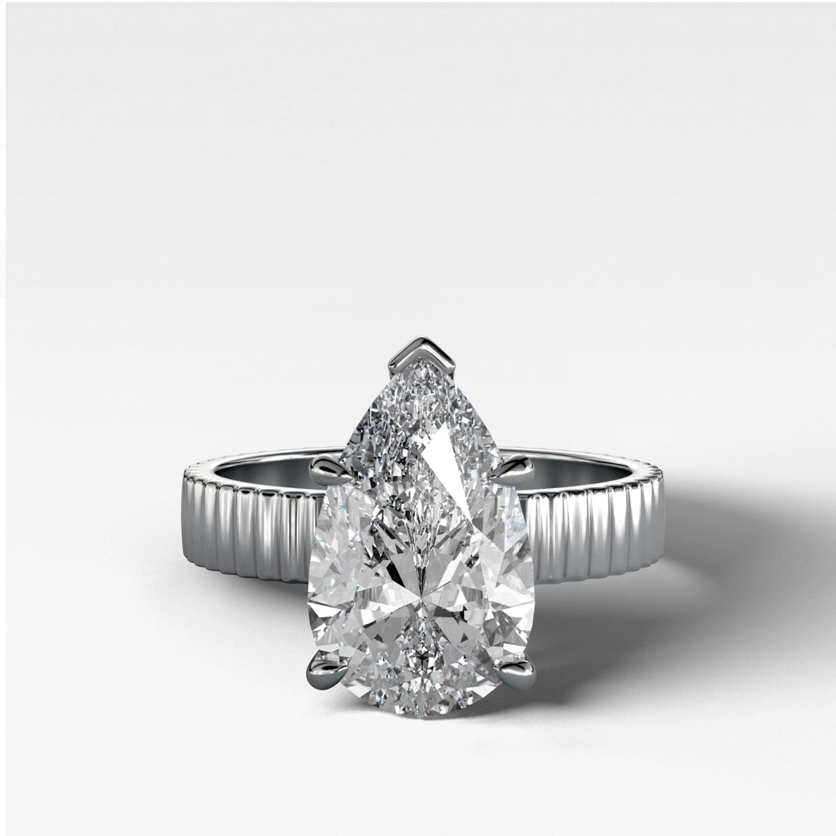 Finest Ridged Solitaire Engagement Ring With Pear Cut Diamond - GOODSTONE