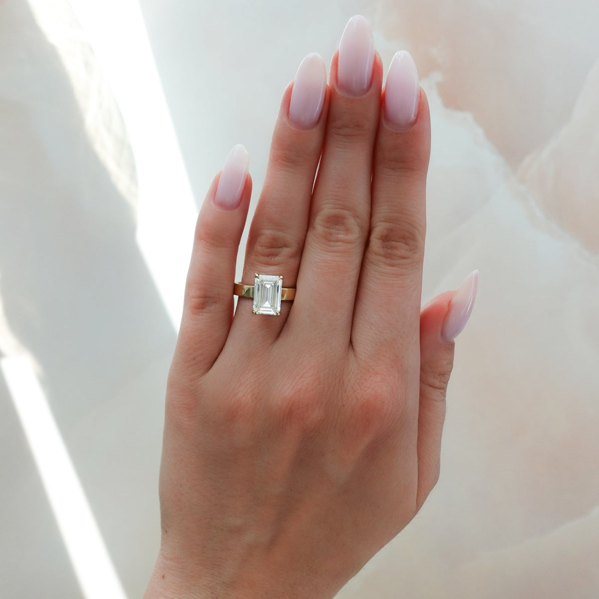 Finest Solitaire Engagement Ring With Emerald Cut Diamond - GOODSTONE