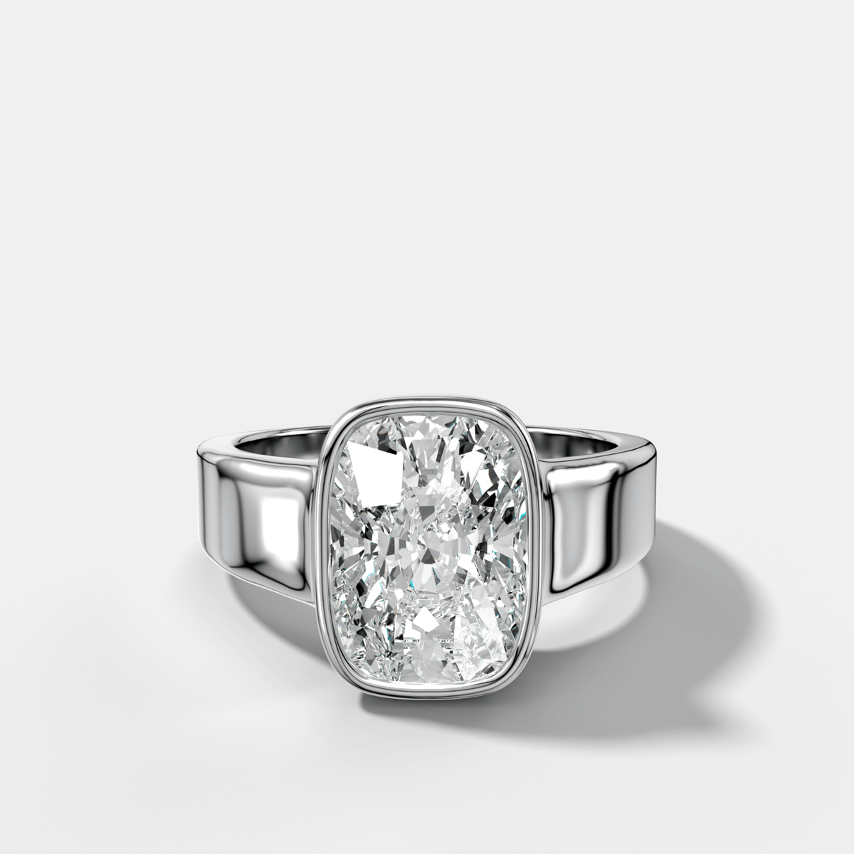 Finest Tapered Bezel Set Engagement Ring With Elongated Cushion Cut Diamond - GOODSTONE