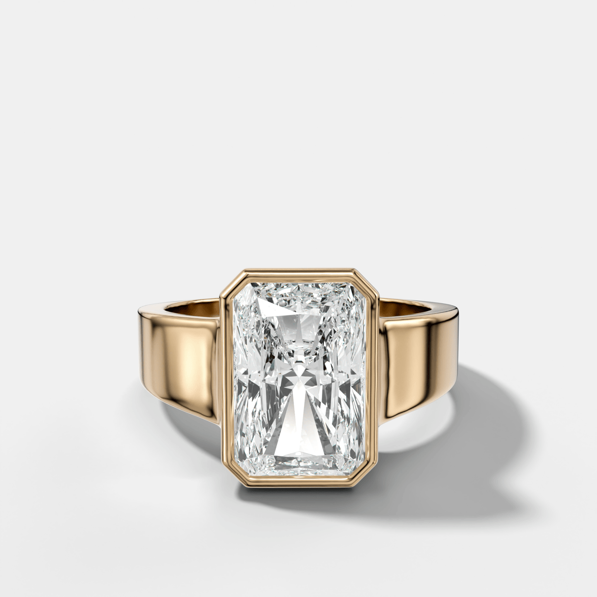 Finest Tapered Bezel Set Engagement Ring With Elongated Radiant Cut Diamond - GOODSTONE