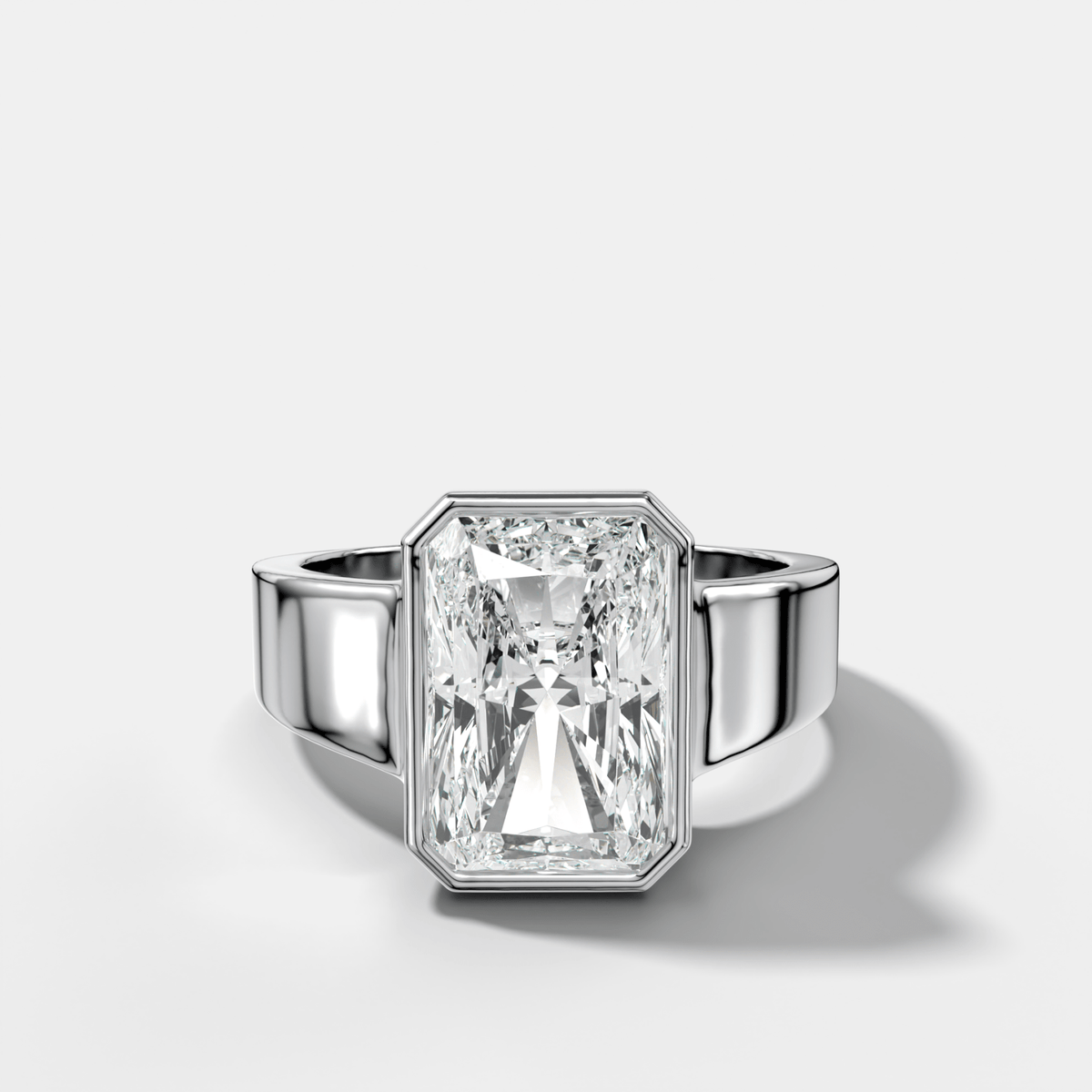 Finest Tapered Bezel Set Engagement Ring With Elongated Radiant Cut Diamond - GOODSTONE