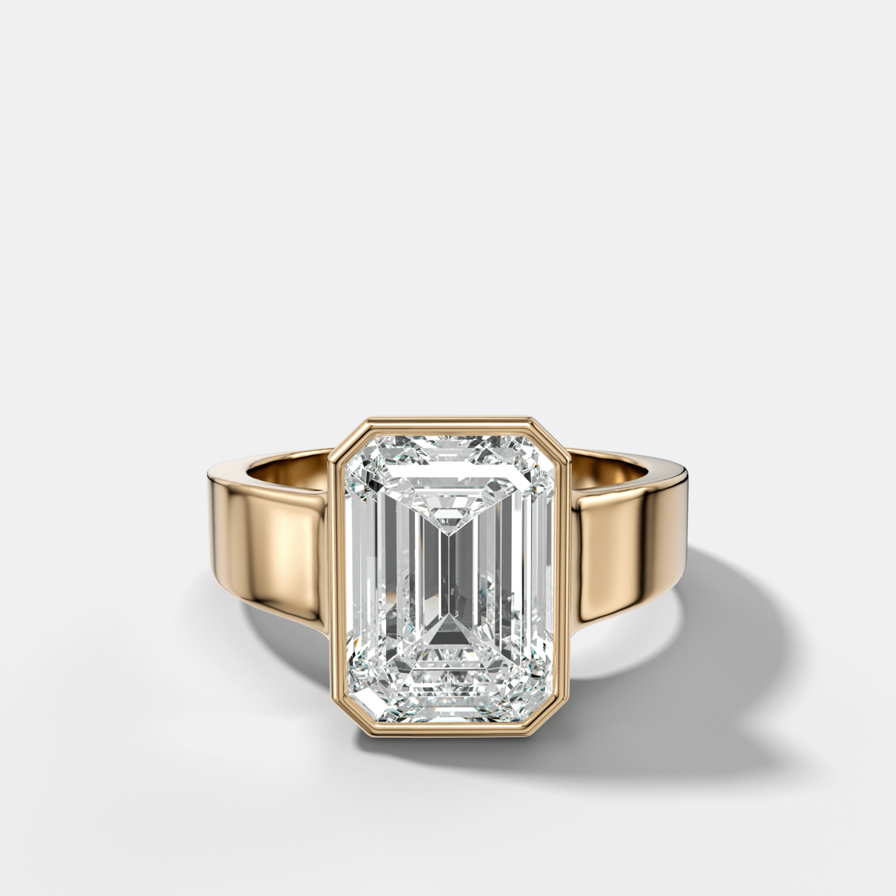 Finest Tapered Bezel Set Engagement Ring With Emerald Cut Diamond - GOODSTONE
