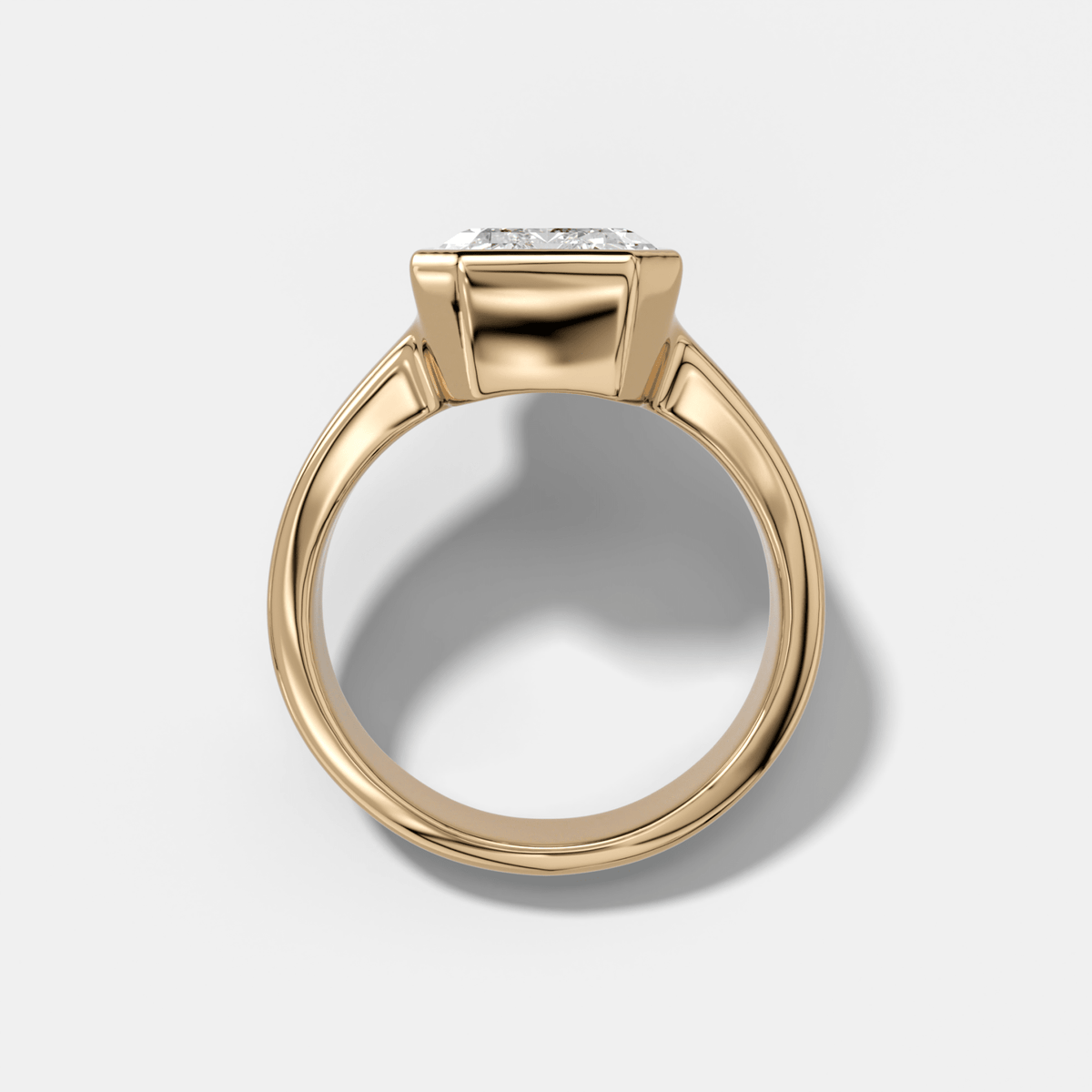 Finest Tapered Bezel Set Engagement Ring With Emerald Cut Diamond - GOODSTONE