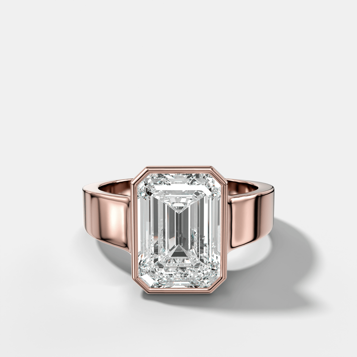 Finest Tapered Bezel Set Engagement Ring With Emerald Cut Diamond - GOODSTONE