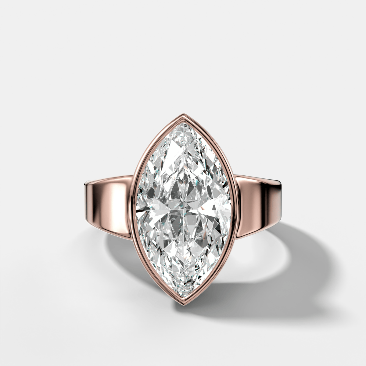 Finest Tapered Bezel Set Engagement Ring With Marquise Cut Diamond - GOODSTONE
