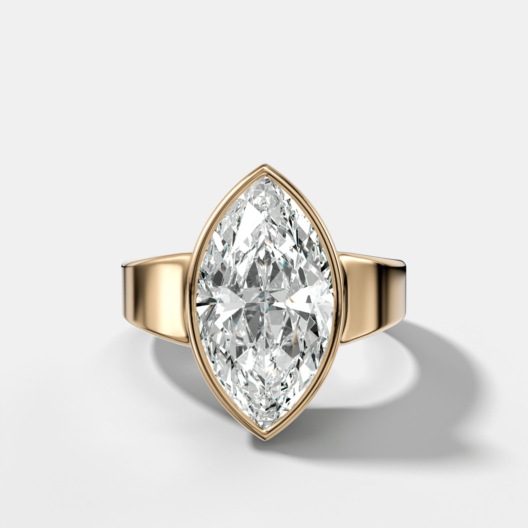 Finest Tapered Bezel Set Engagement Ring With Marquise Cut Diamond - GOODSTONE