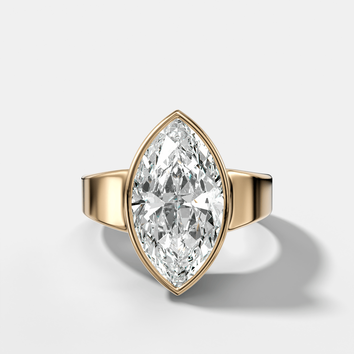Finest Tapered Bezel Set Engagement Ring With Marquise Cut Diamond - GOODSTONE
