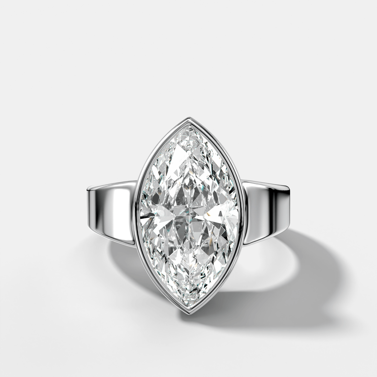 Finest Tapered Bezel Set Engagement Ring With Marquise Cut Diamond - GOODSTONE