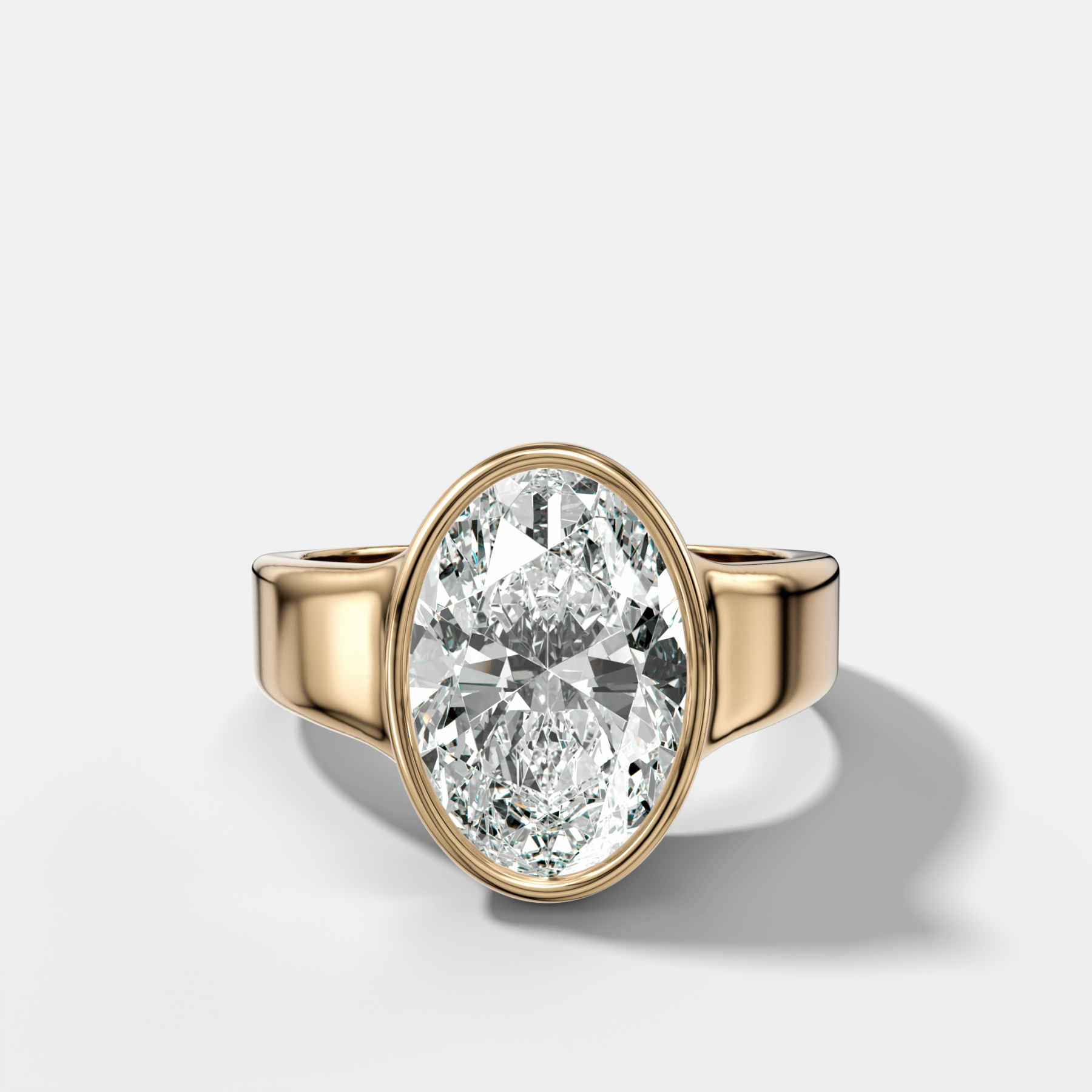 Finest Tapered Bezel Set Engagement Ring With Oval Cut Diamond - GOODSTONE