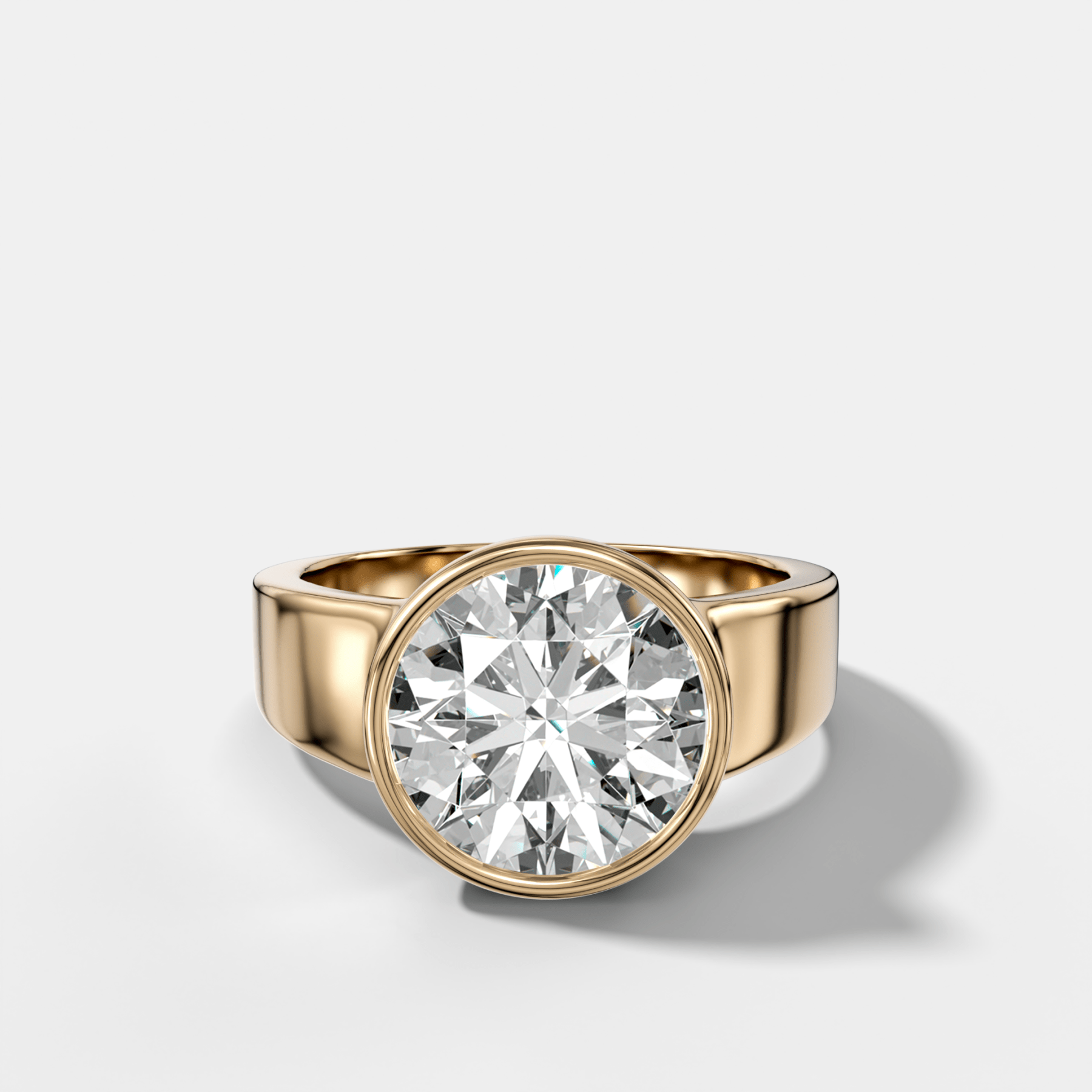 Finest Tapered Bezel Set Engagement Ring With Round Cut Diamond - GOODSTONE