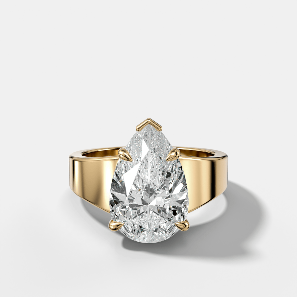 Finest Tapered Engagement Ring With Pear Cut Diamond - GOODSTONE