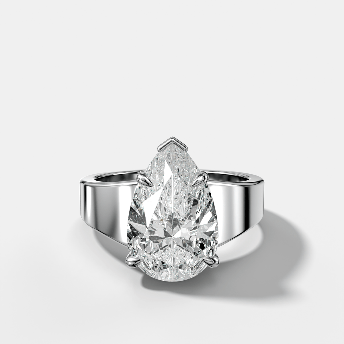 Finest Tapered Engagement Ring With Pear Cut Diamond - GOODSTONE