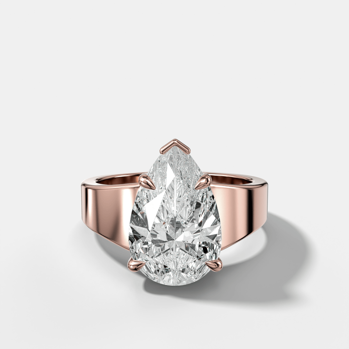 Finest Tapered Engagement Ring With Pear Cut Diamond - GOODSTONE