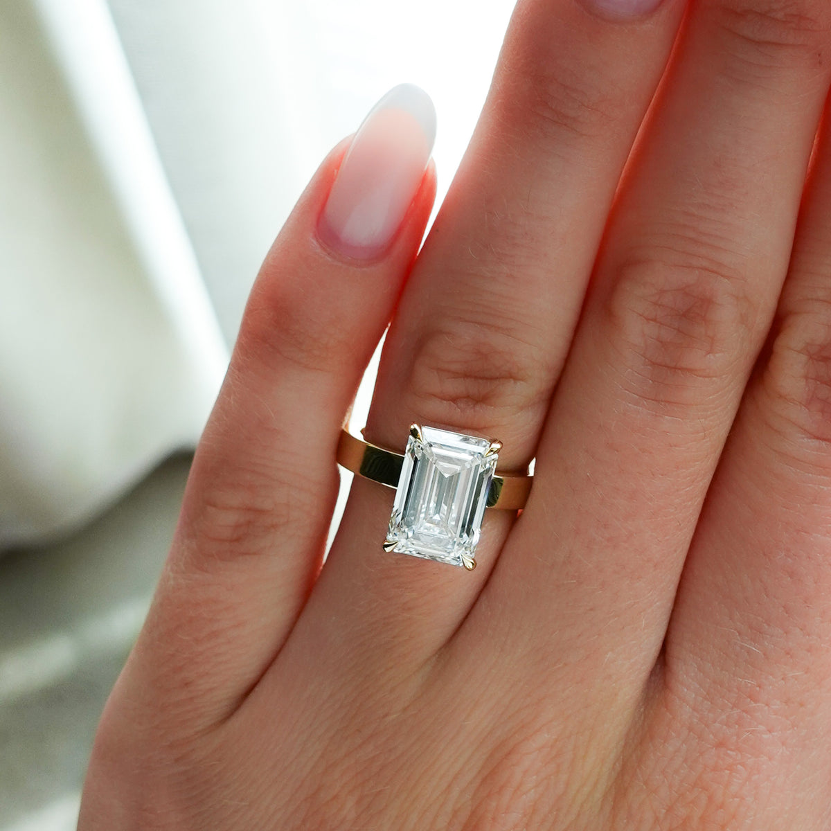 Finest Solitaire Engagement Ring With Lab Grown 5.07ct Emerald Cut Diamond