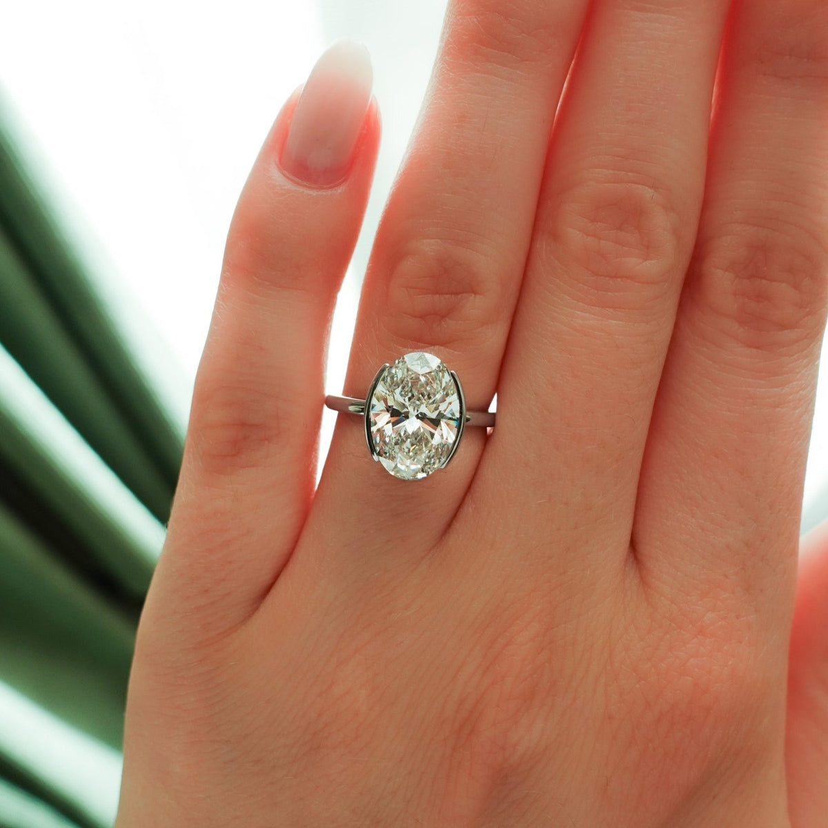 Half Bezel Solitaire Engagement Ring With Oval Cut Diamond - GOODSTONE