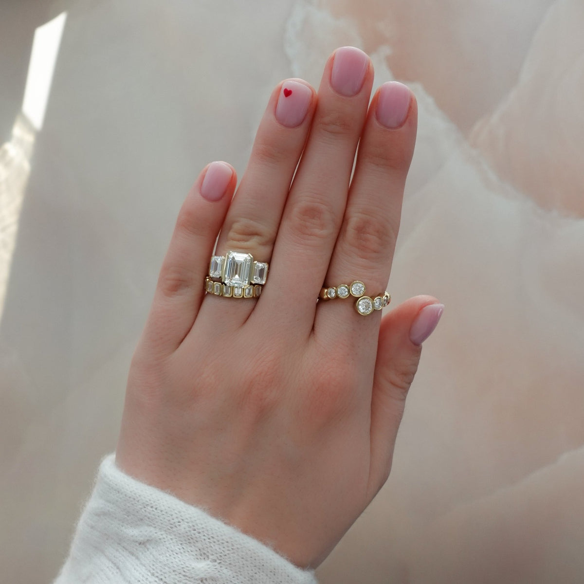 Half Bezel Triad Engagement Ring With Emerald Cut Diamonds - GOODSTONE