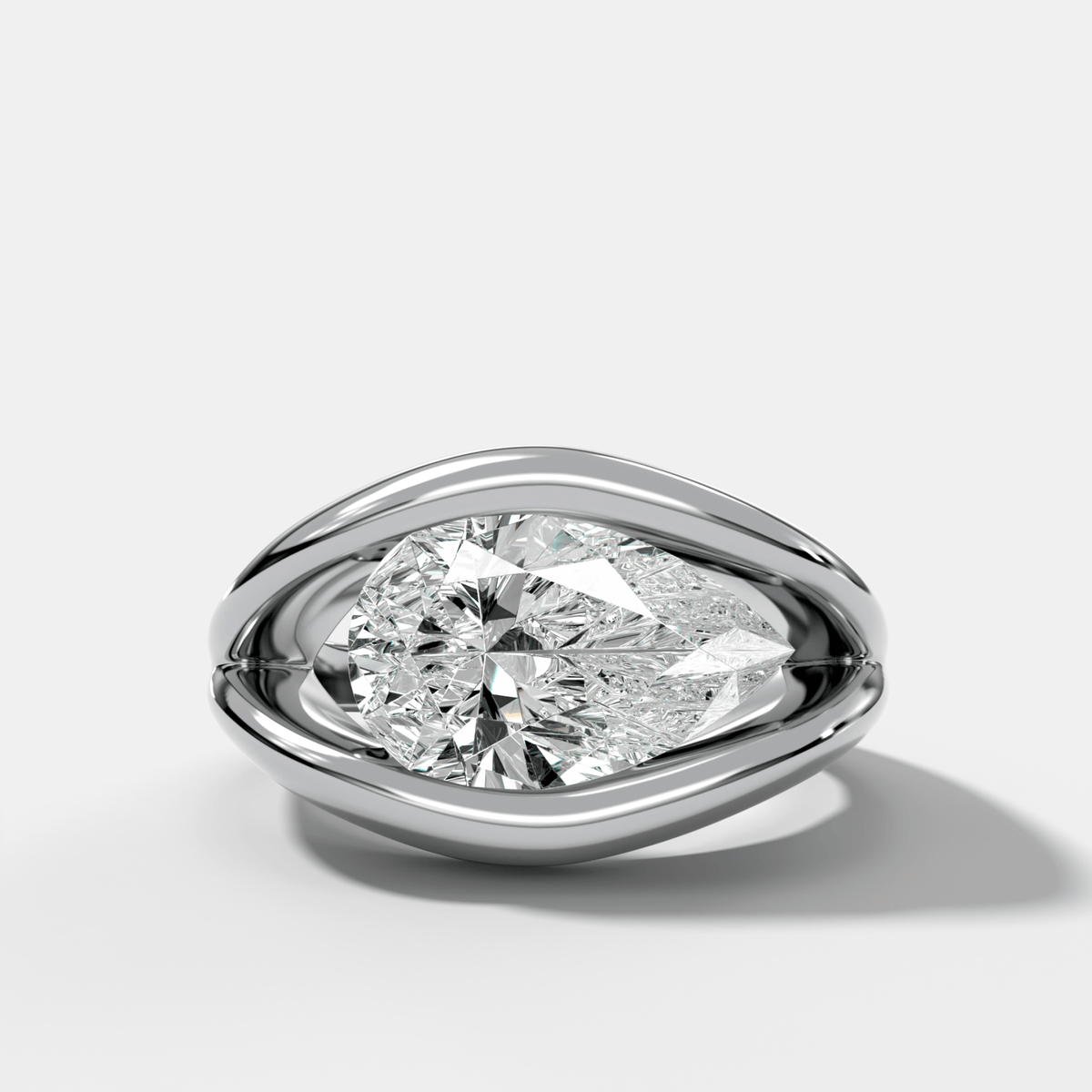 Iris Engagement Ring With a Pear Cut Diamond - GOODSTONE