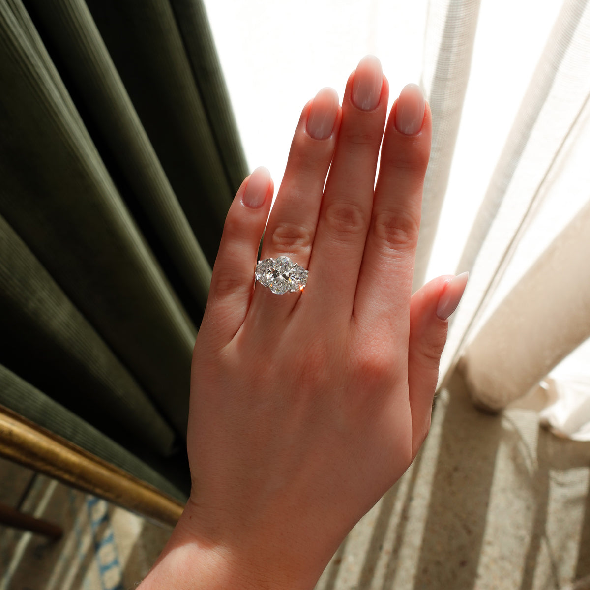 Jumbo Three Stone ring with Half Moon sides & an Oval Cut