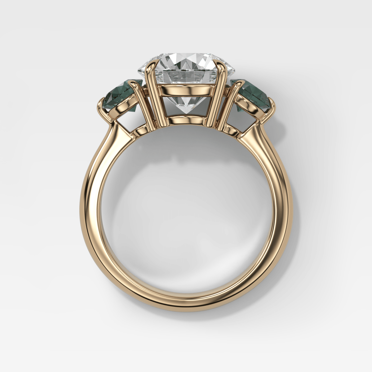 Martini Three Stone Engagement Ring With Round Cut Diamond and Green Sapphires - GOODSTONE