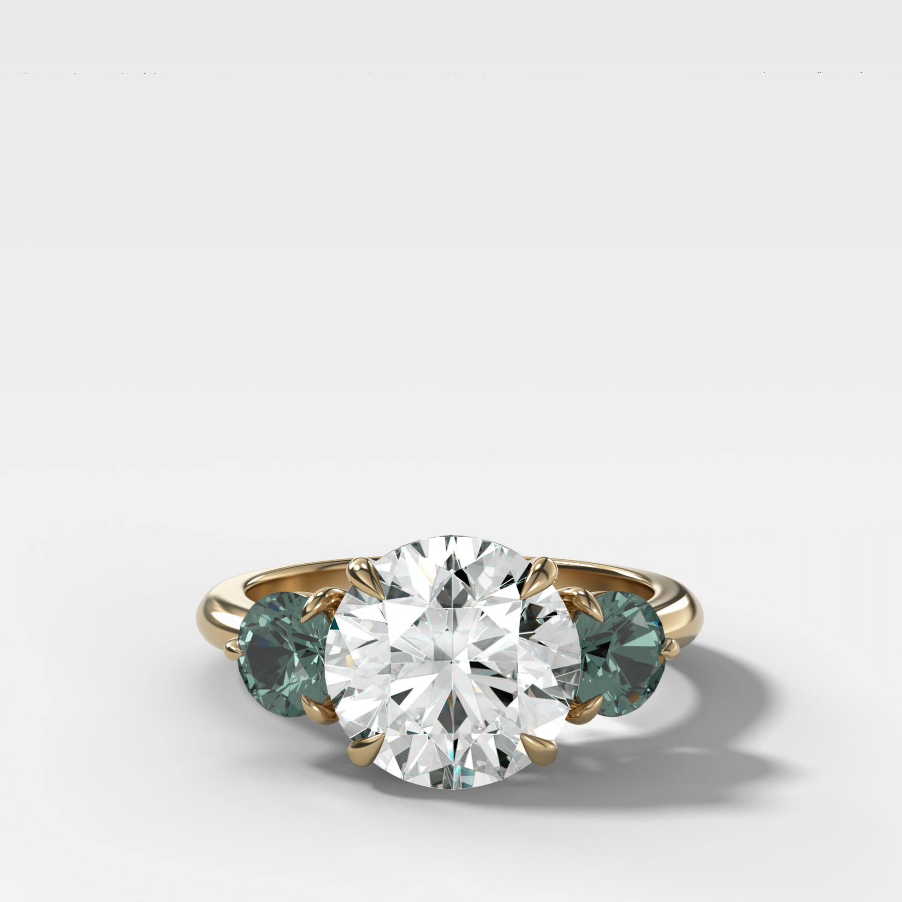 Martini Three Stone Engagement Ring With Round Cut Diamond and Green Sapphires - GOODSTONE