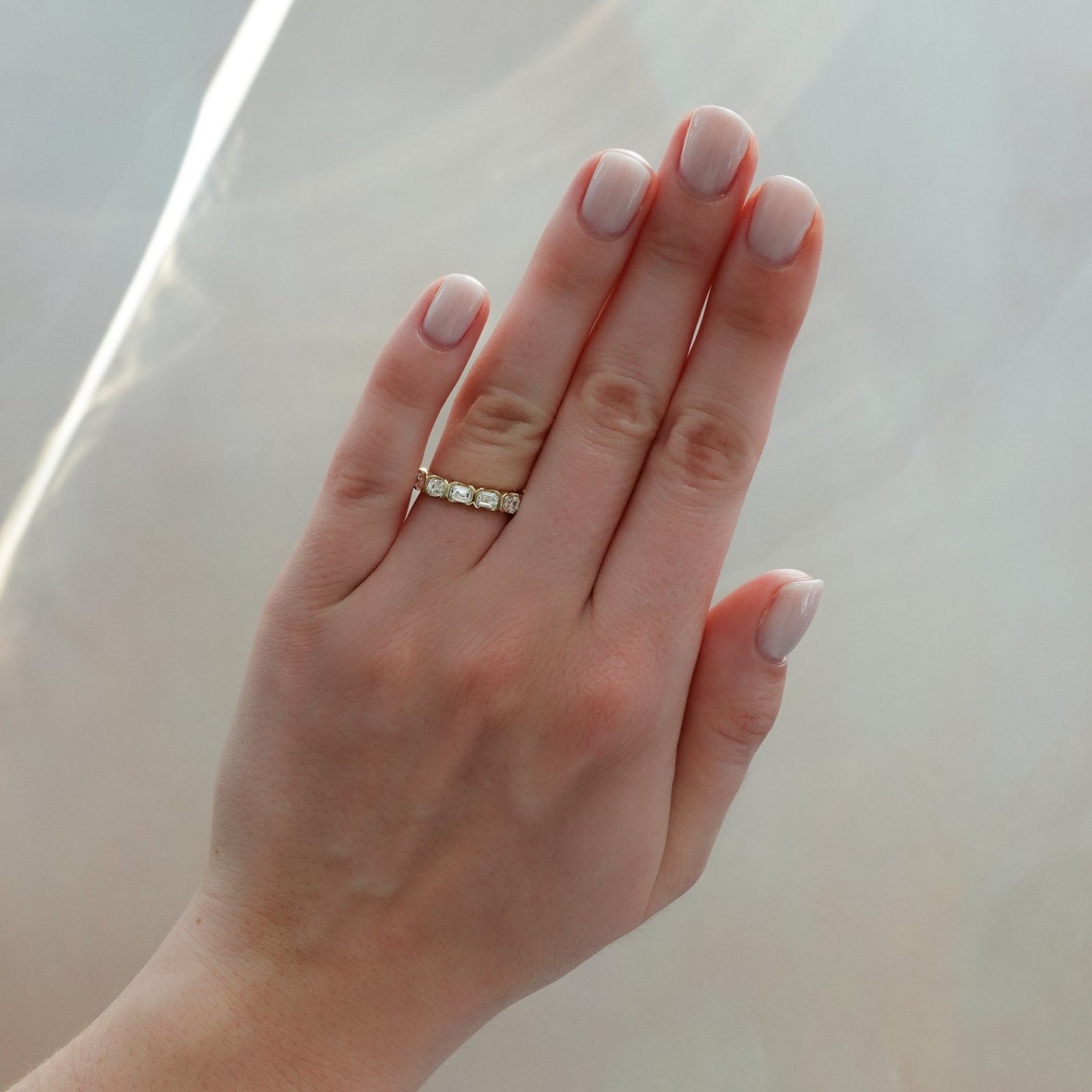 Midi Half Bezel Set Wedding Band With East West Emerald Cuts - GOODSTONE