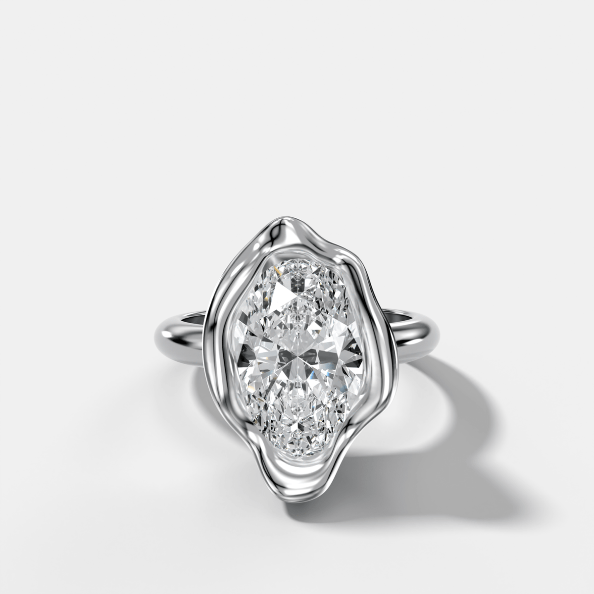 Molten Bezel Engagement Ring With an Oval Cut Diamond - GOODSTONE