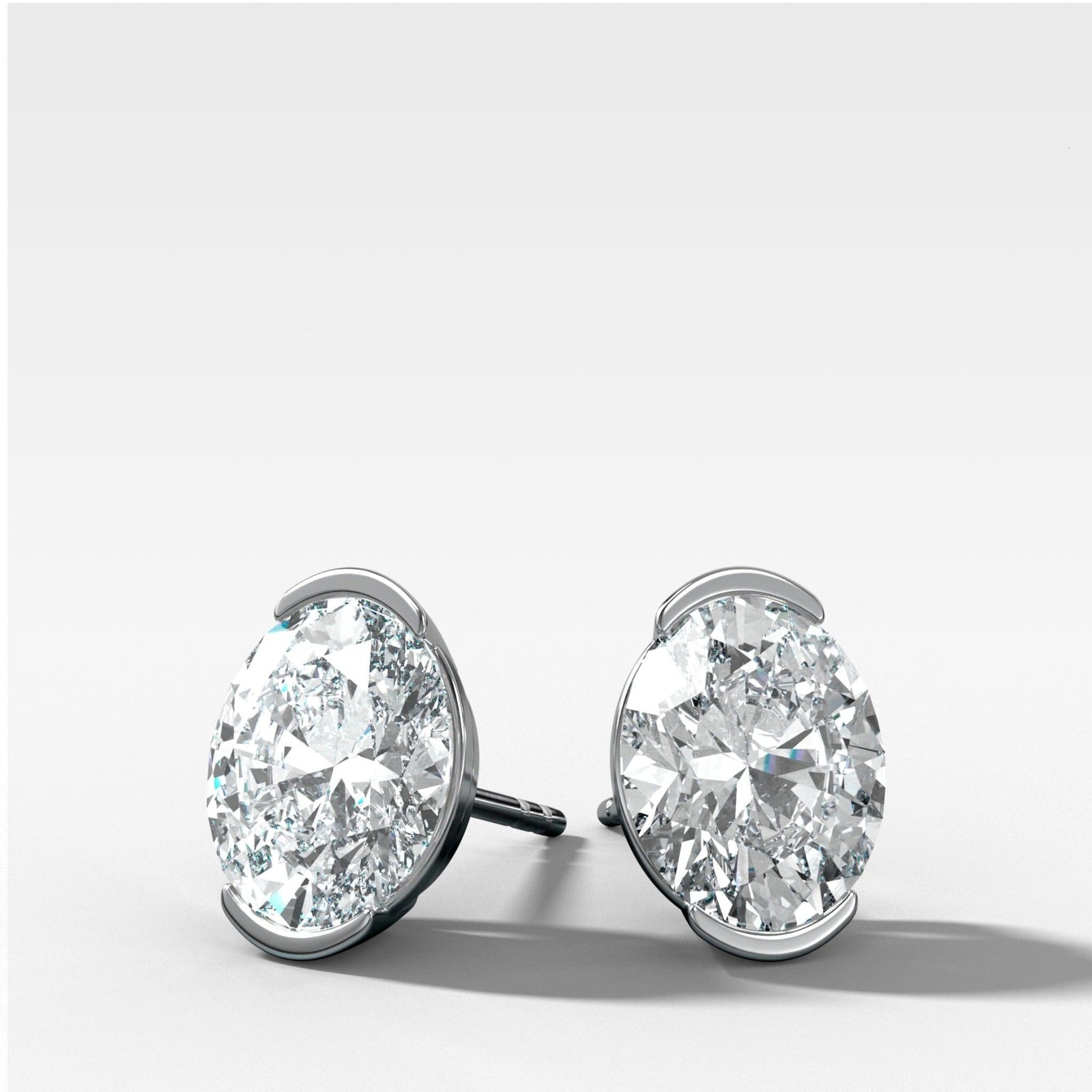 Oval Cut Half Bezel Diamond Studs - GOODSTONE